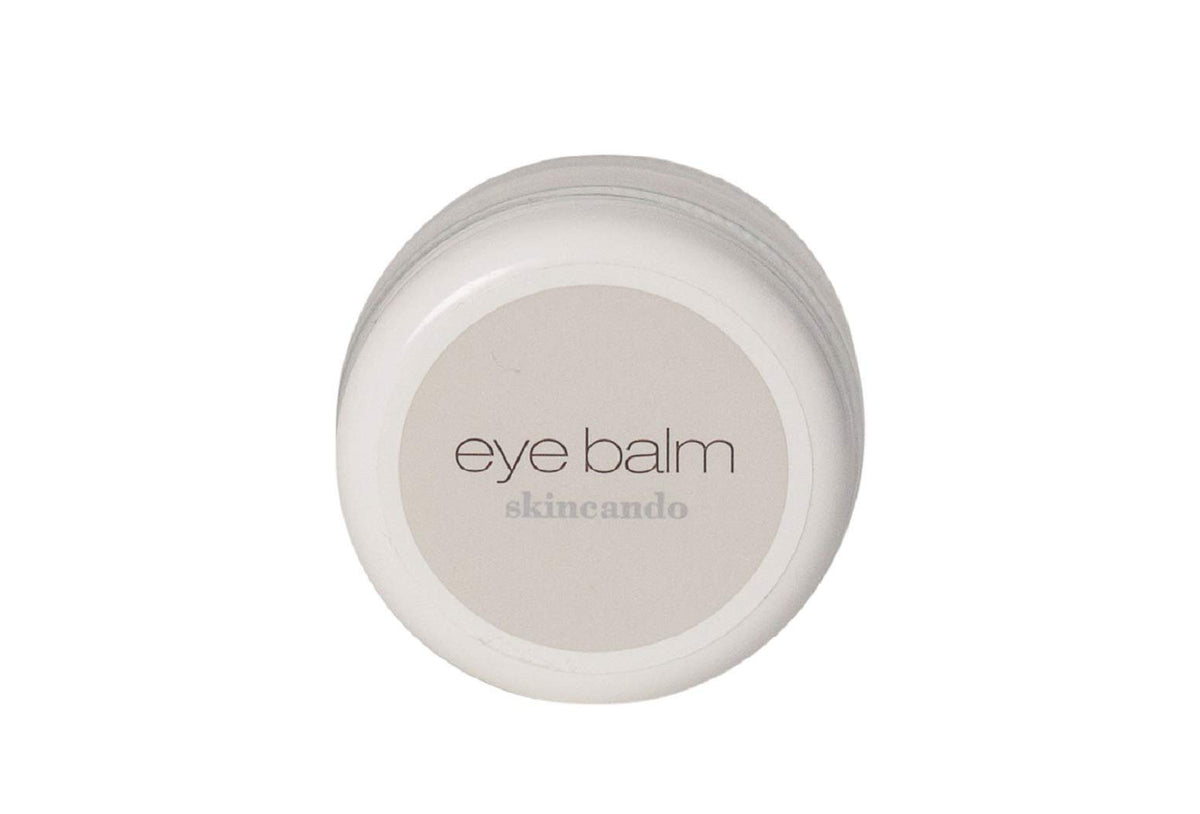 Skincando Eye Balm jar highlighting dark circles and brightened under-eye area.