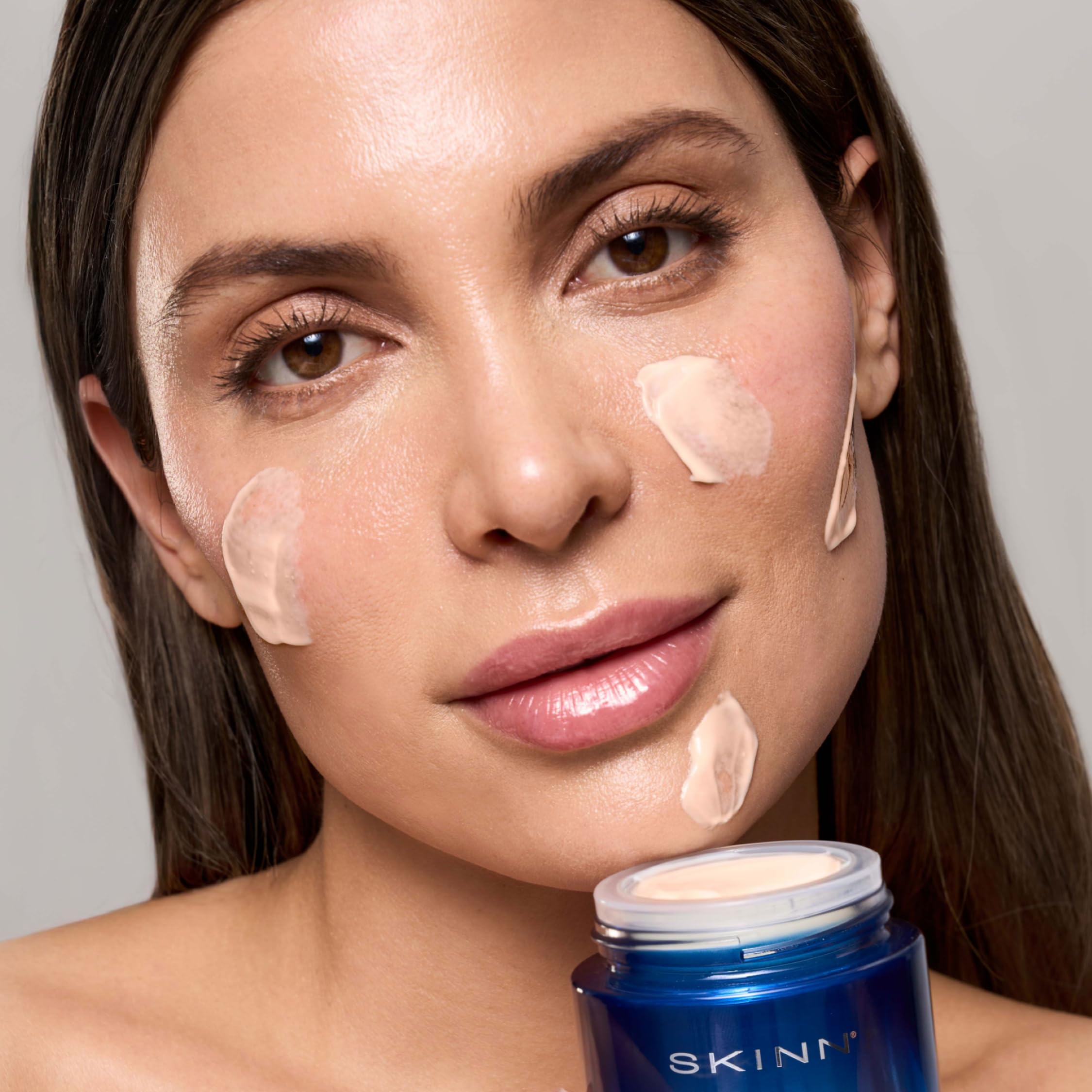 SKINN Age Reset on-face swatch showing natural glow