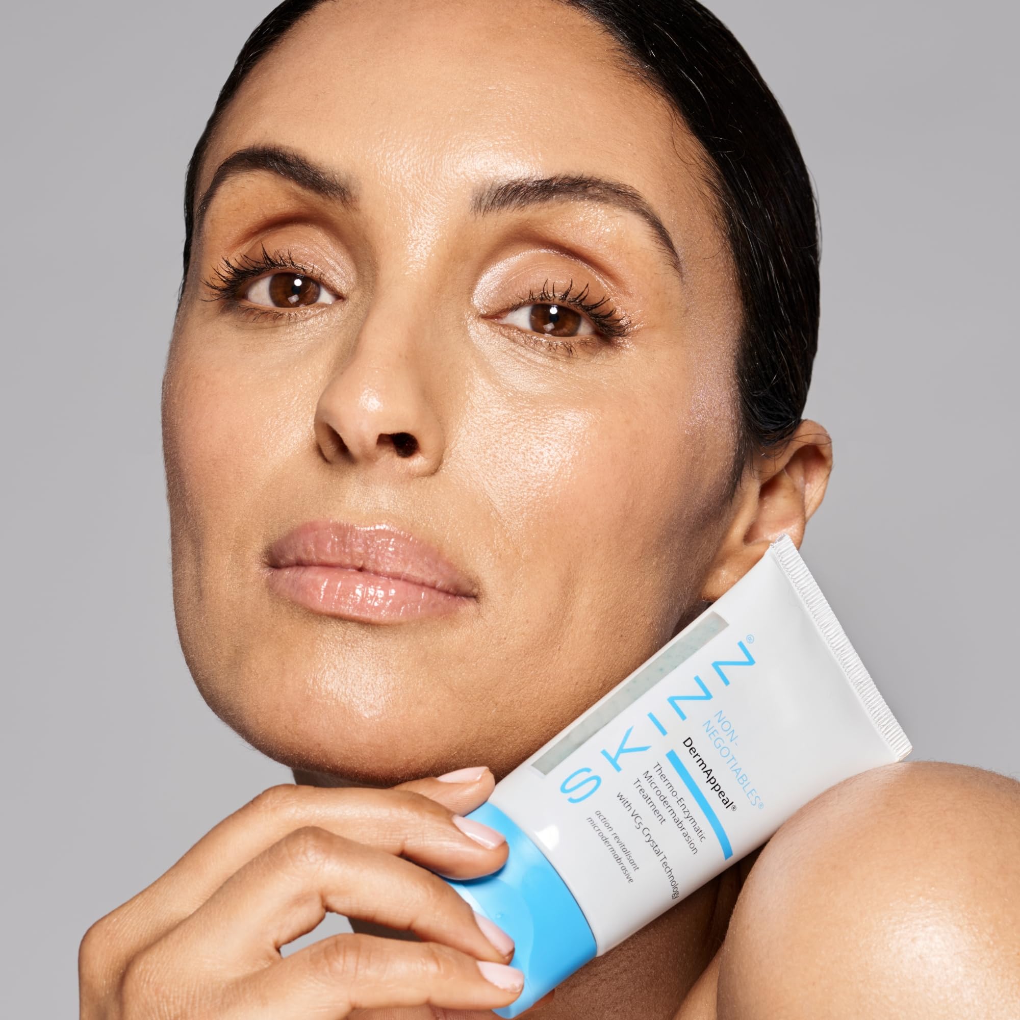 SKINN DermAppeal dual-action exfoliation visual conveys enzymes plus physical particles.