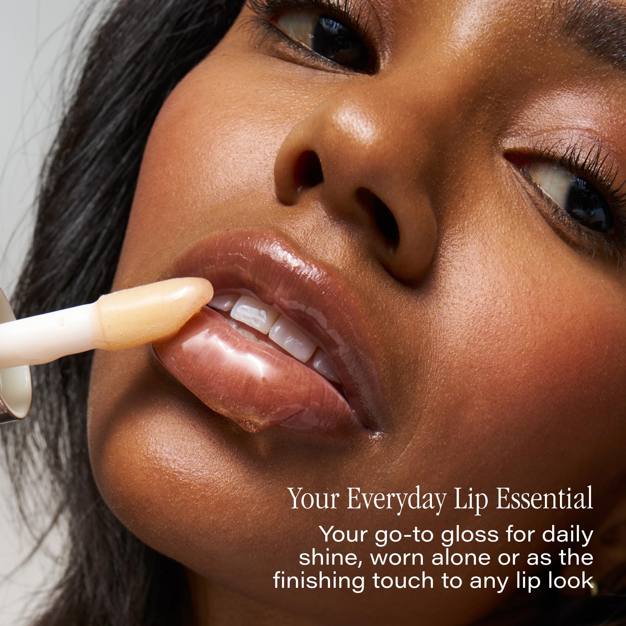 Close-up of SKINN lip oil bottle highlighting premium packaging