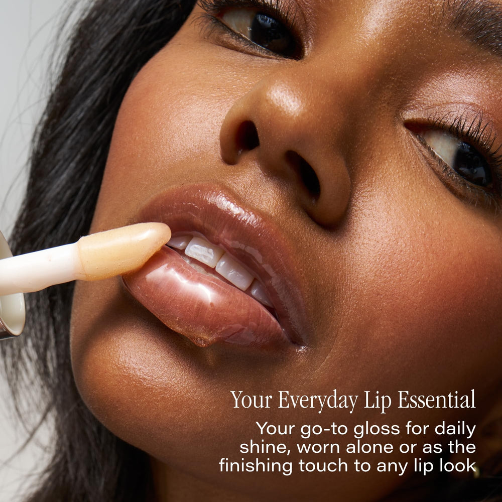 Close-up of SKINN lip oil bottle highlighting premium packaging