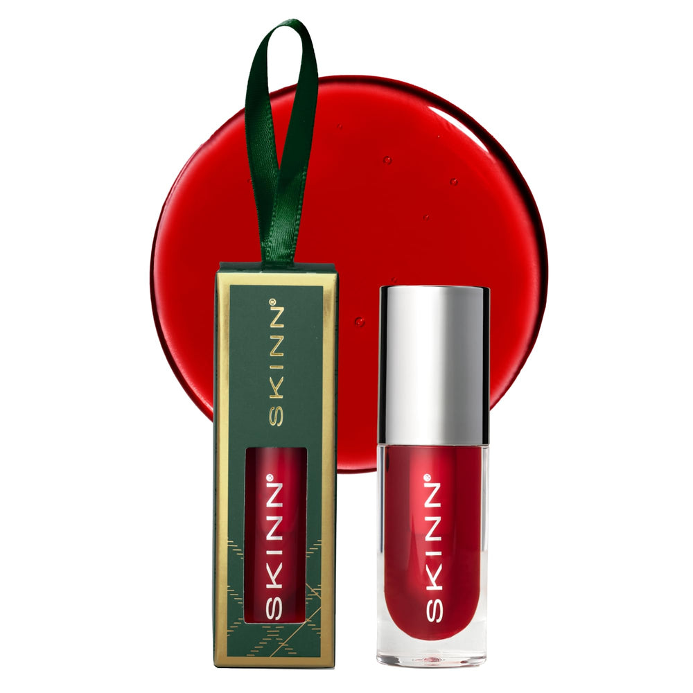 SKINN Luminous Lip Oil Crimson bottle swirl delivers silky shine and hydration.
