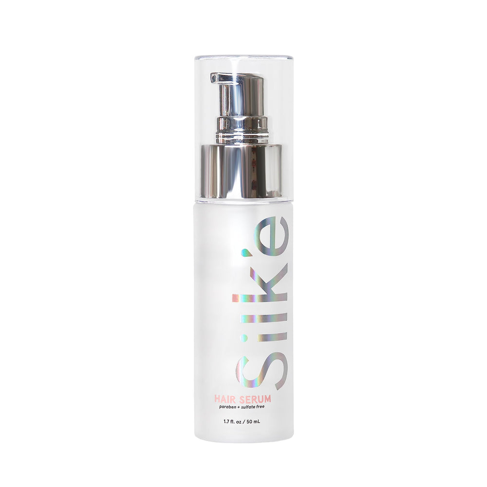 Sleek'e Silk'e hair serum bottle close-up showing frizz control and silky shine.