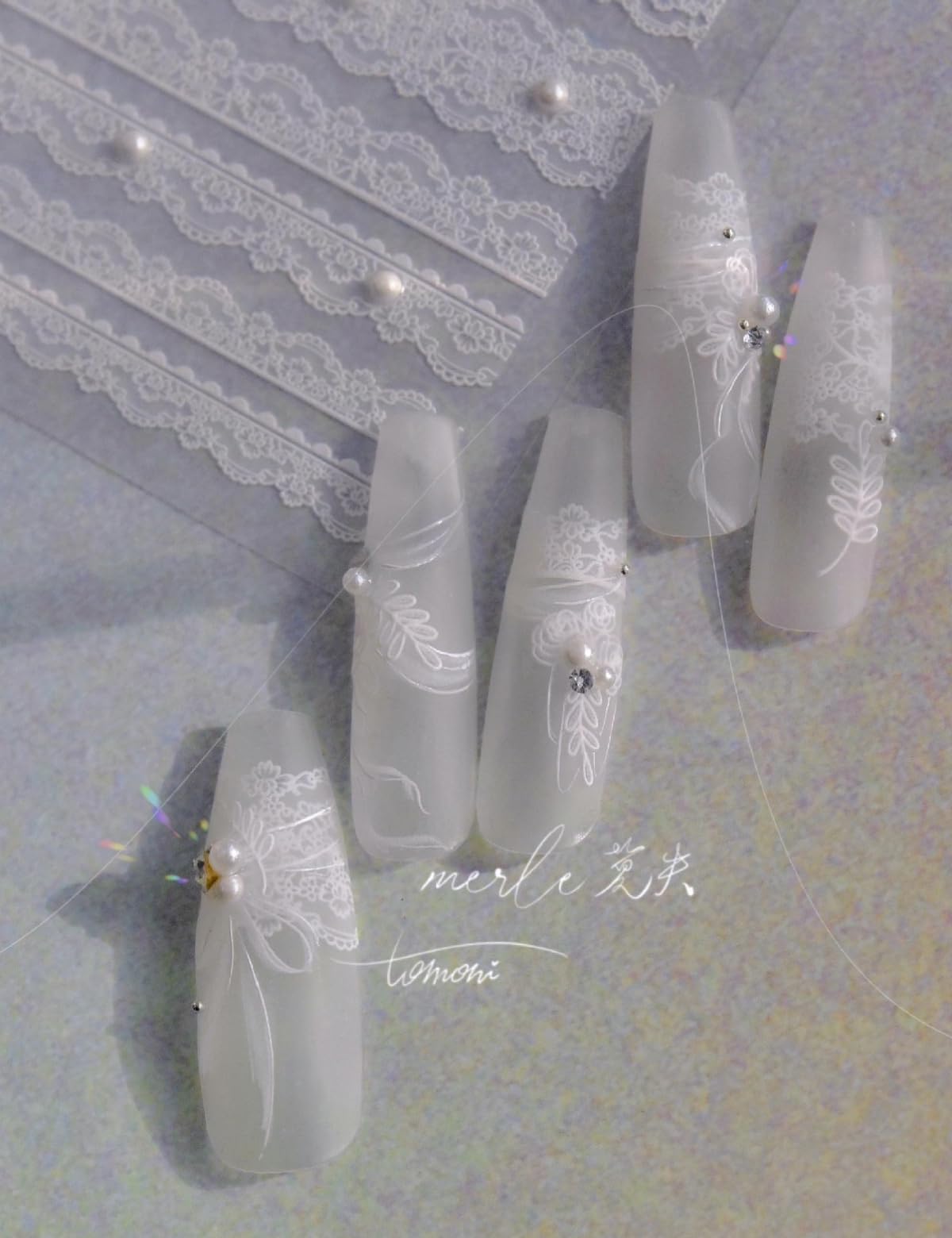 SOFTSOUL 5D embossed pearl on natural nail for durable, salon-like finish.