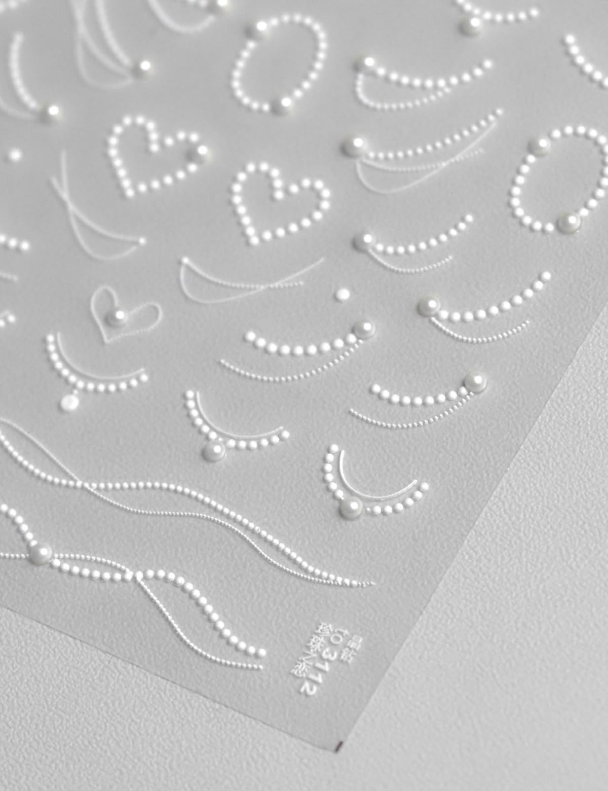 SOFTSOUL rhinestones and pearls nail stickers embossed sheet for a luxe salon look.