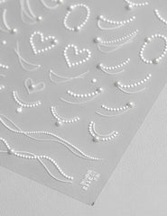 SOFTSOUL rhinestones and pearls nail stickers embossed sheet for a luxe salon look.