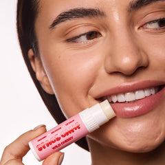 Space Camp Wellness lip balm being applied for daily moisture