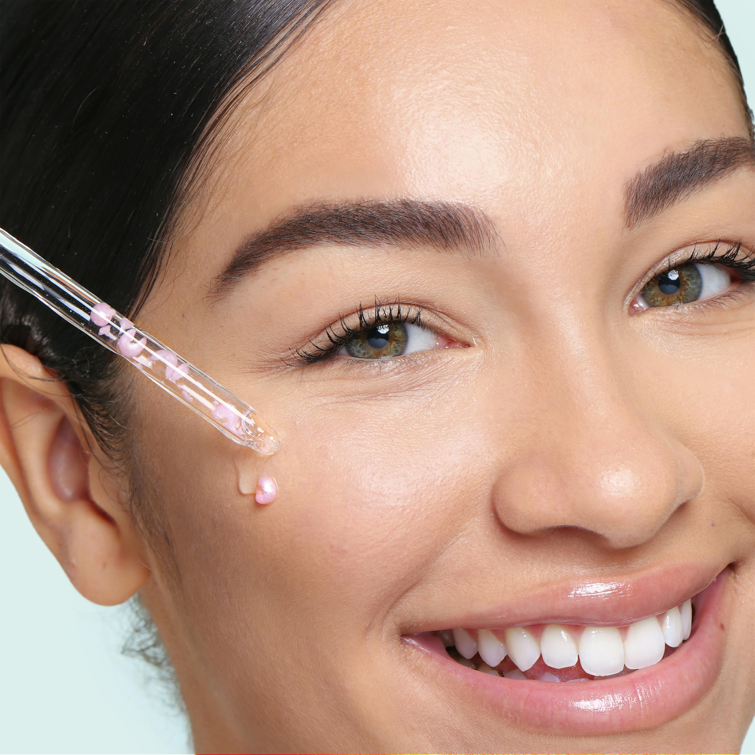 SpaLife pearl capsules dissolve to add instant luminosity to hydrated skin.