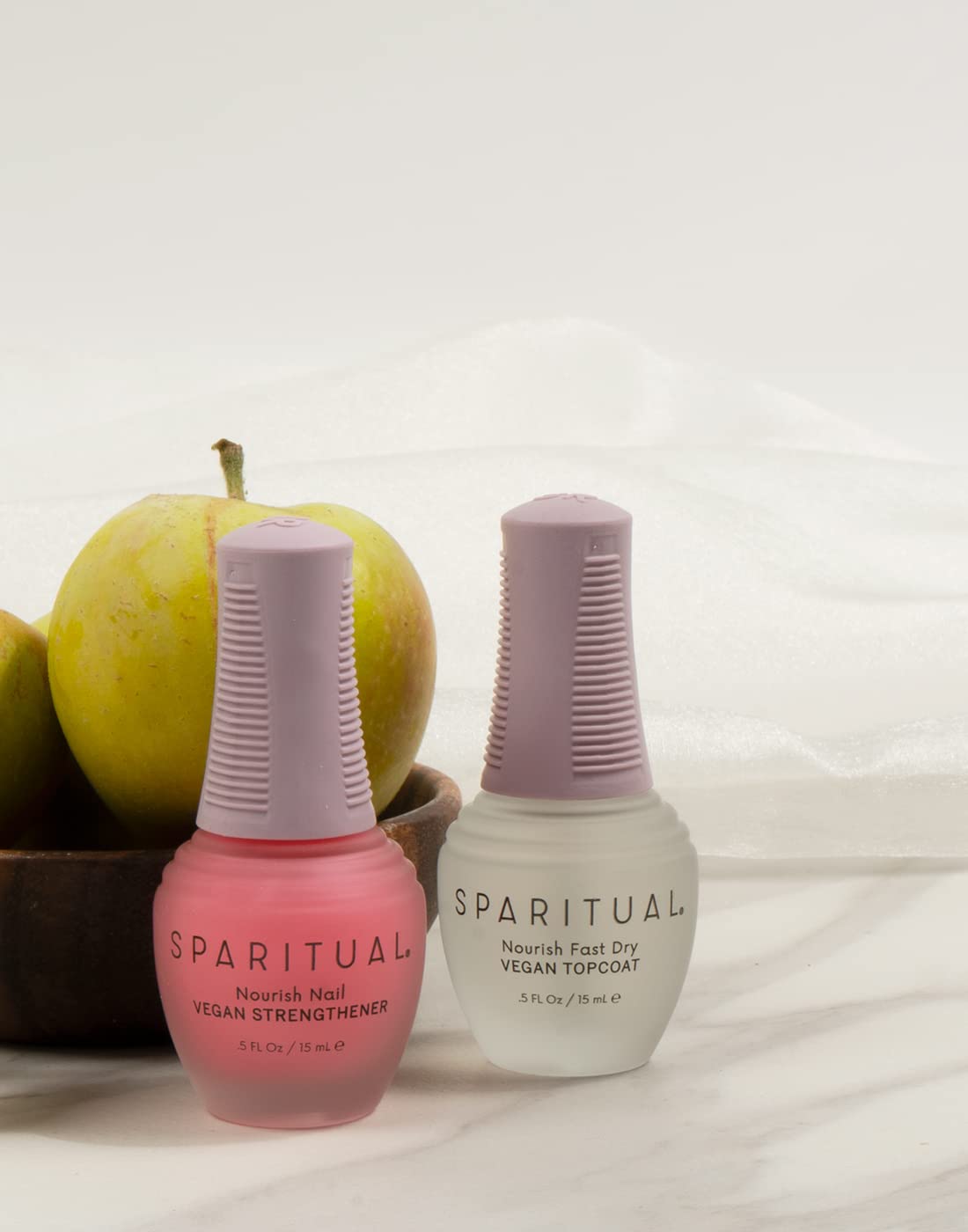 SpaRitual Nourish Nail Strengthener brush applying coating on nails for protection