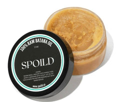 Spoild Batana Oil bottle 2oz for nourishing hair growth.