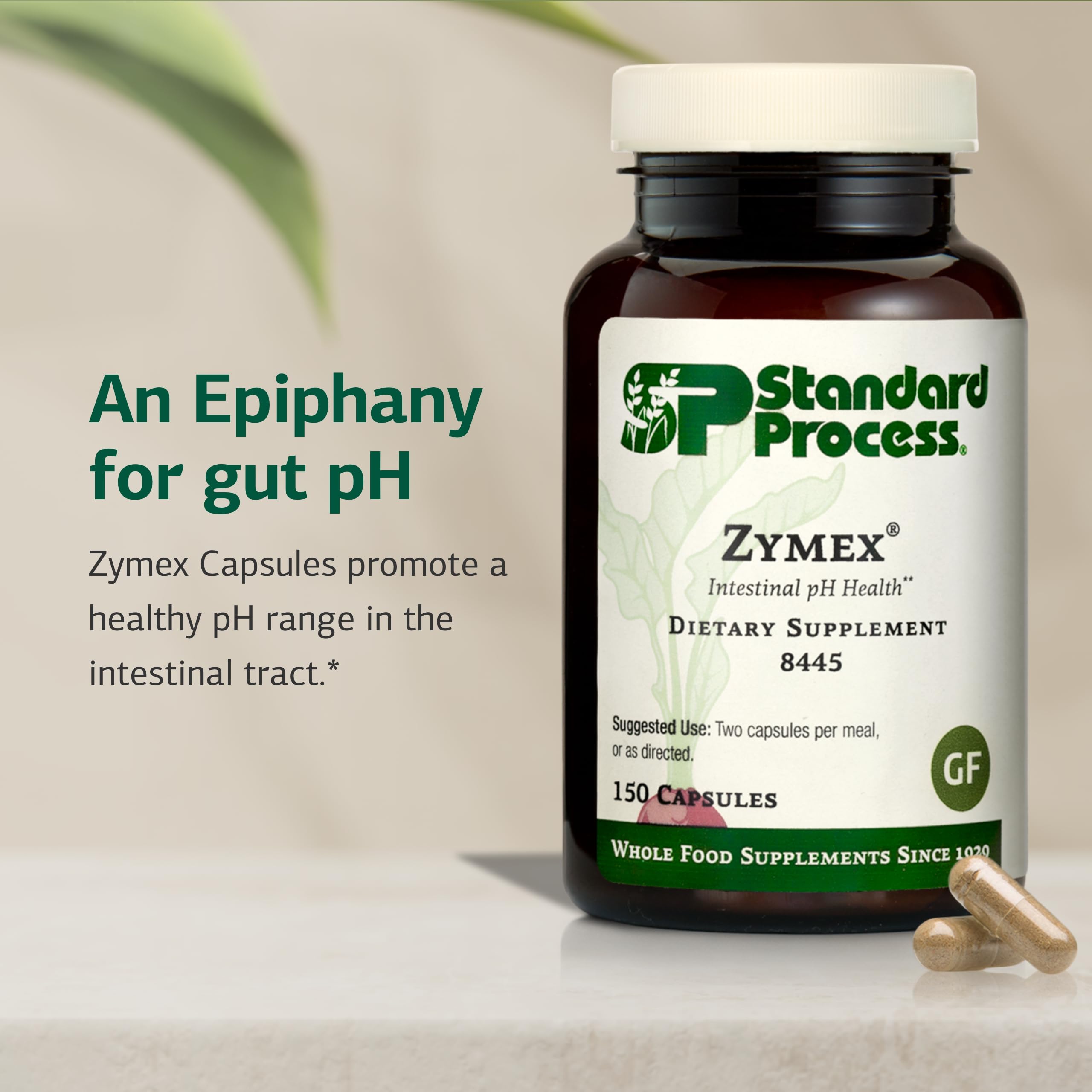 Standard Process Zymex capsules being poured for daily intake