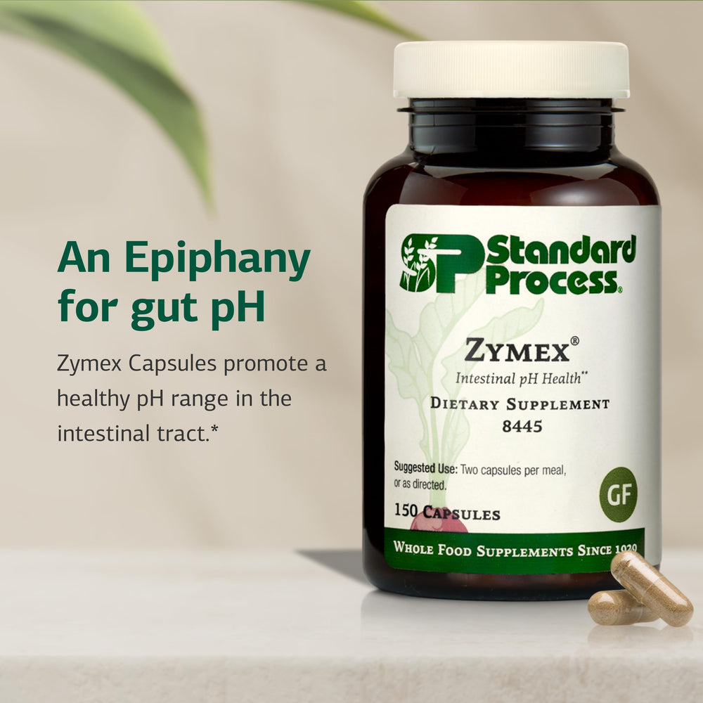 Standard Process Zymex capsules being poured for daily intake