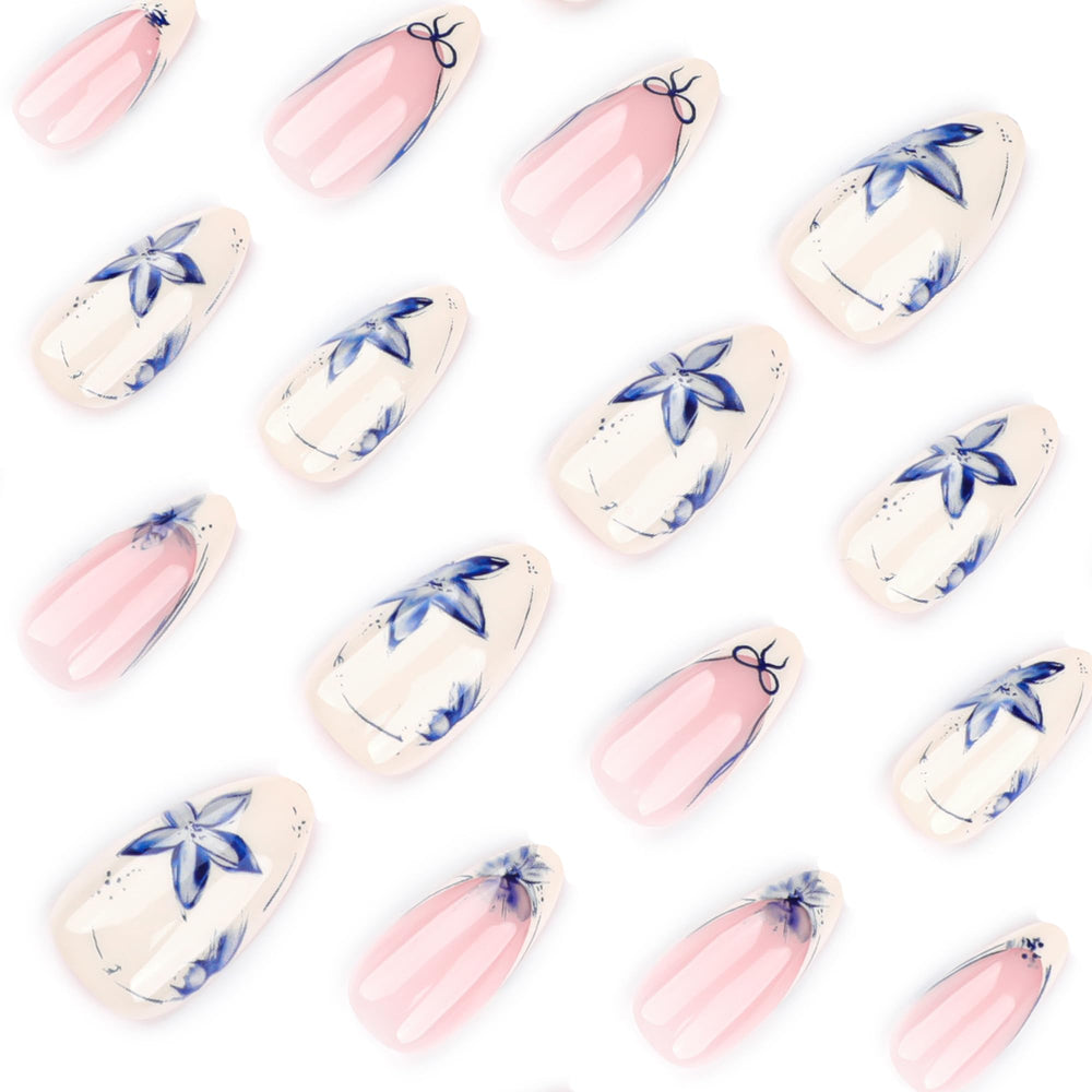 Stbisen short tips featuring blue petals for easy at‑home manicures.