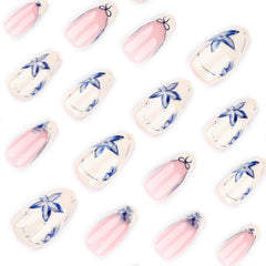 Stbisen short tips featuring blue petals for easy at‑home manicures.