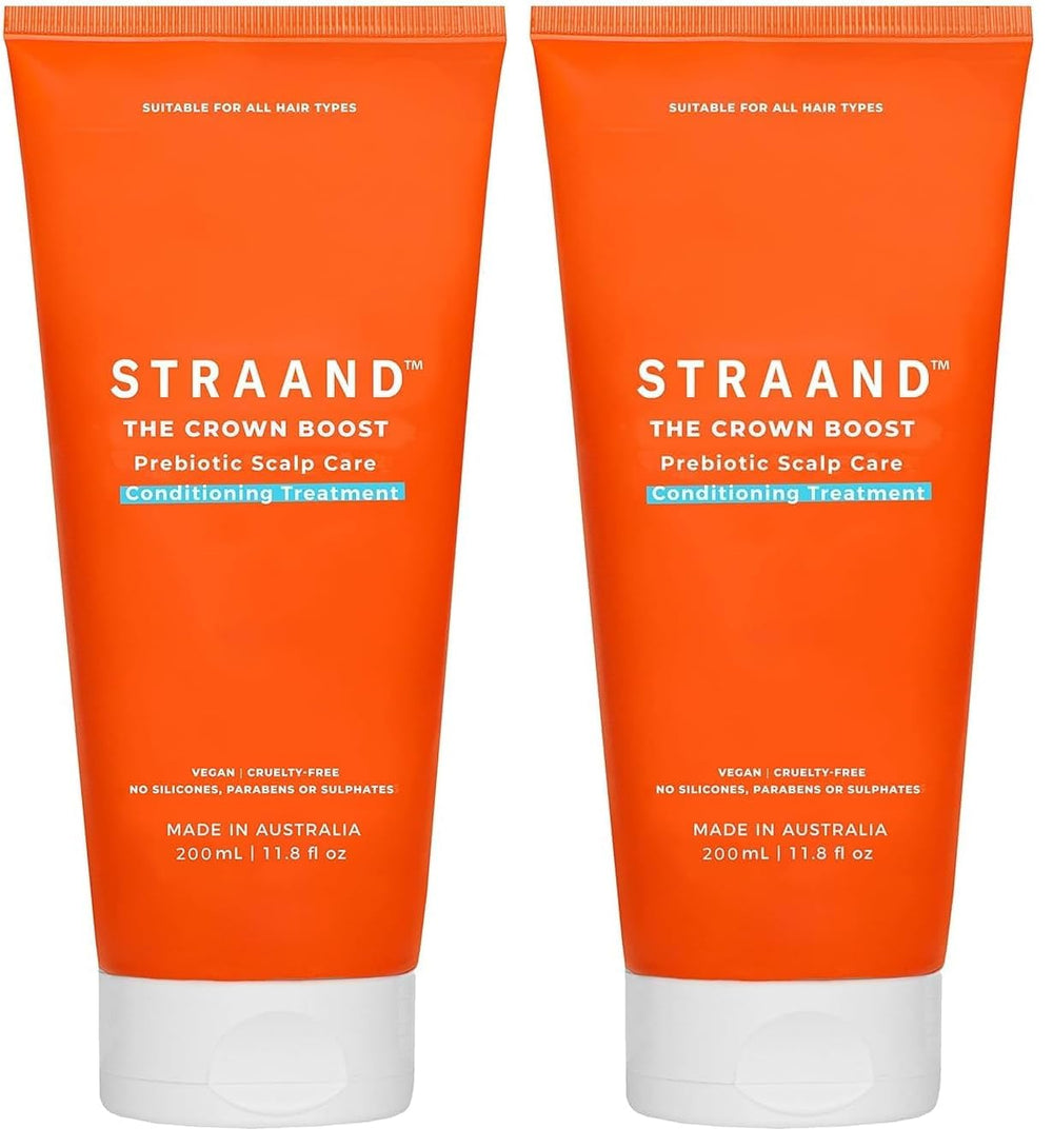 Straand Crown Boost bottle close-up showing hydrating conditioning action