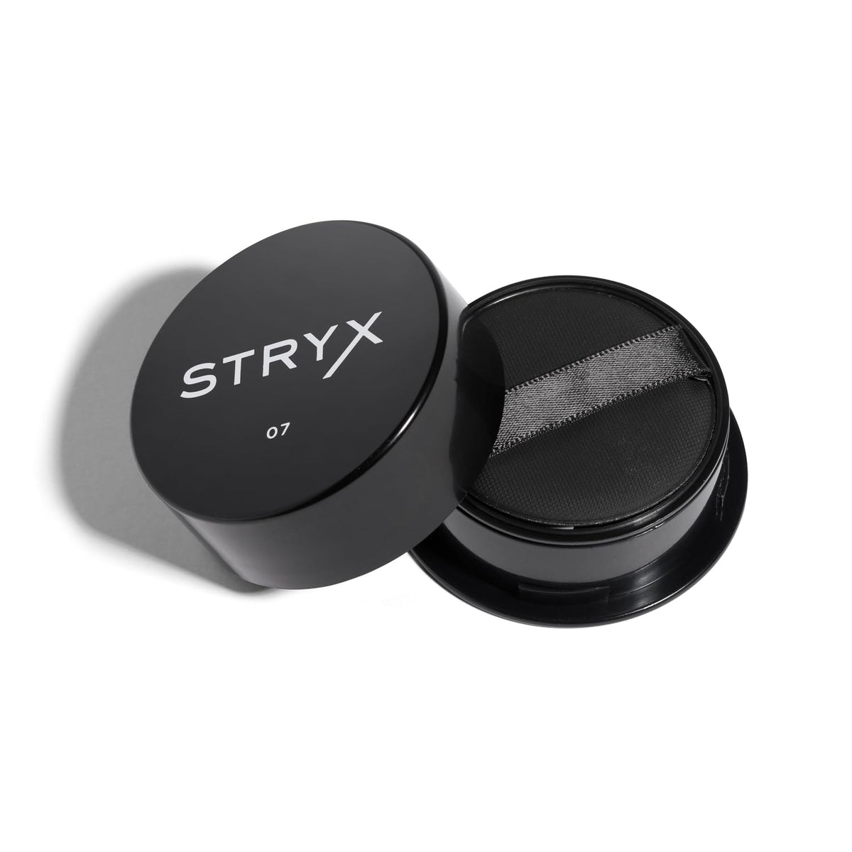 Stryx Anti-Shine Powder compact with built-in sponge for quick touch-ups.