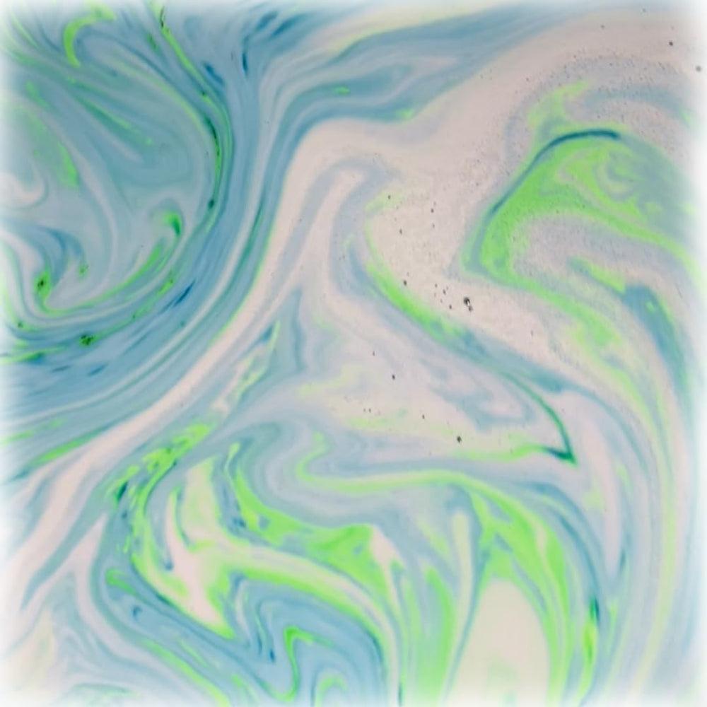 Stsfybaths turquoise shimmer bath bomb in action adds spa like ambiance to bath time