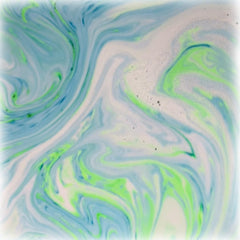 Stsfybaths turquoise shimmer bath bomb in action adds spa like ambiance to bath time