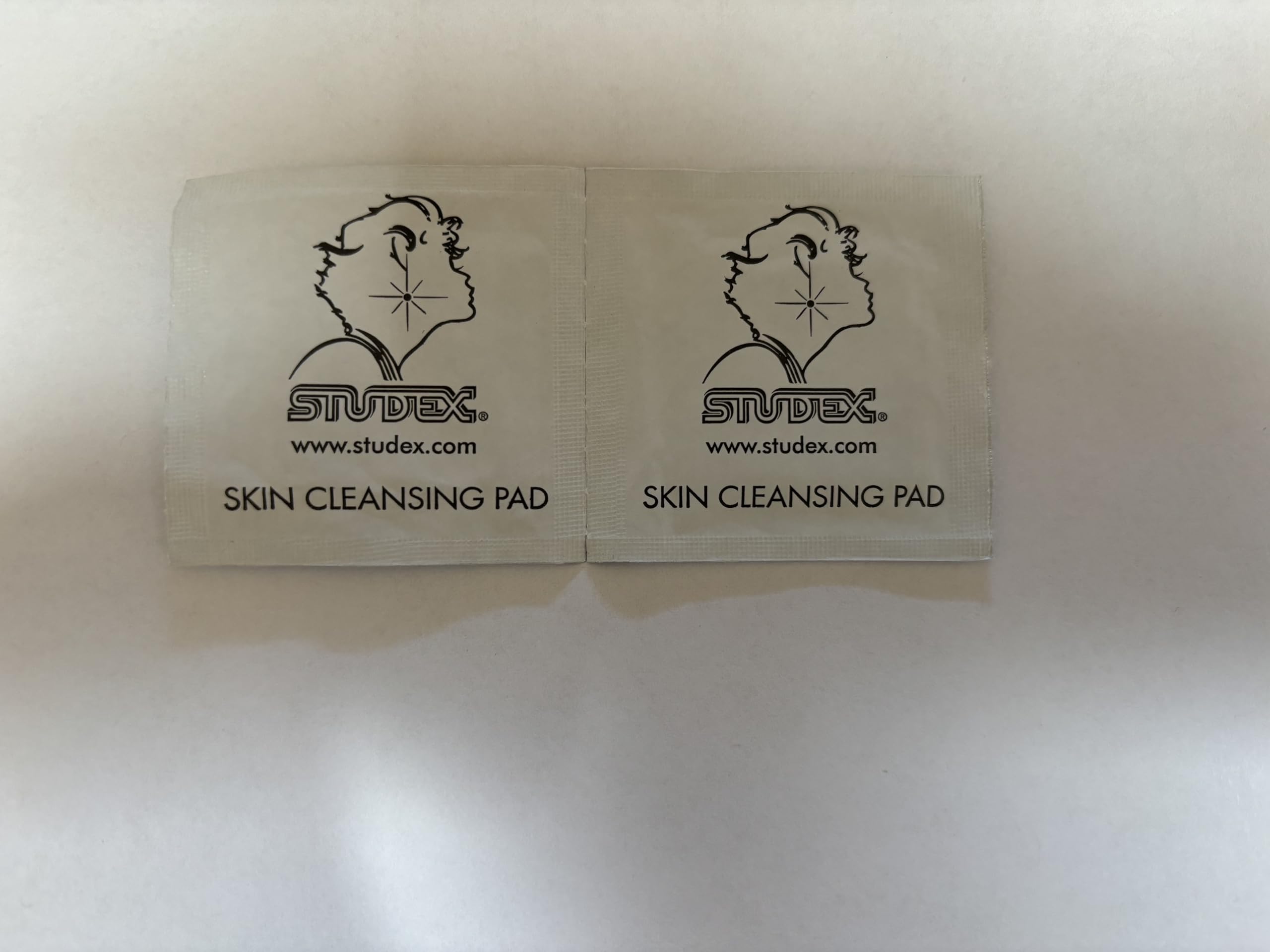 Studex kit packaging and sterilized earrings emphasize hypoallergenic safety