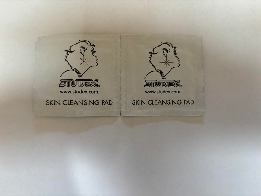 Studex kit packaging and sterilized earrings emphasize hypoallergenic safety
