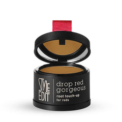 Style Edit Root Touch Up Powder close-up showing color-adaptive pigments blending with red tones