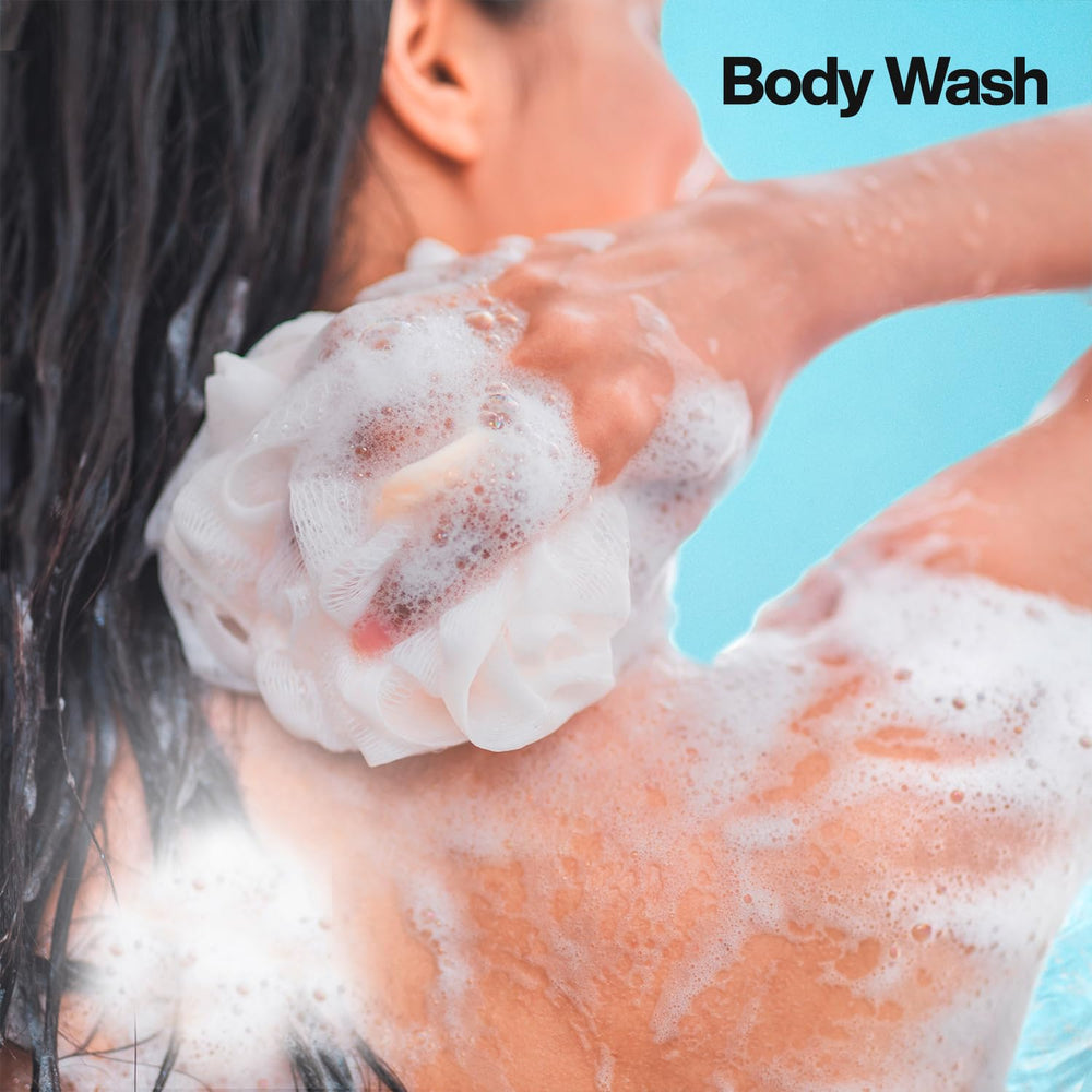 Suave Ocean Breeze body wash lather close-up shows rich, hydrating bubbles.