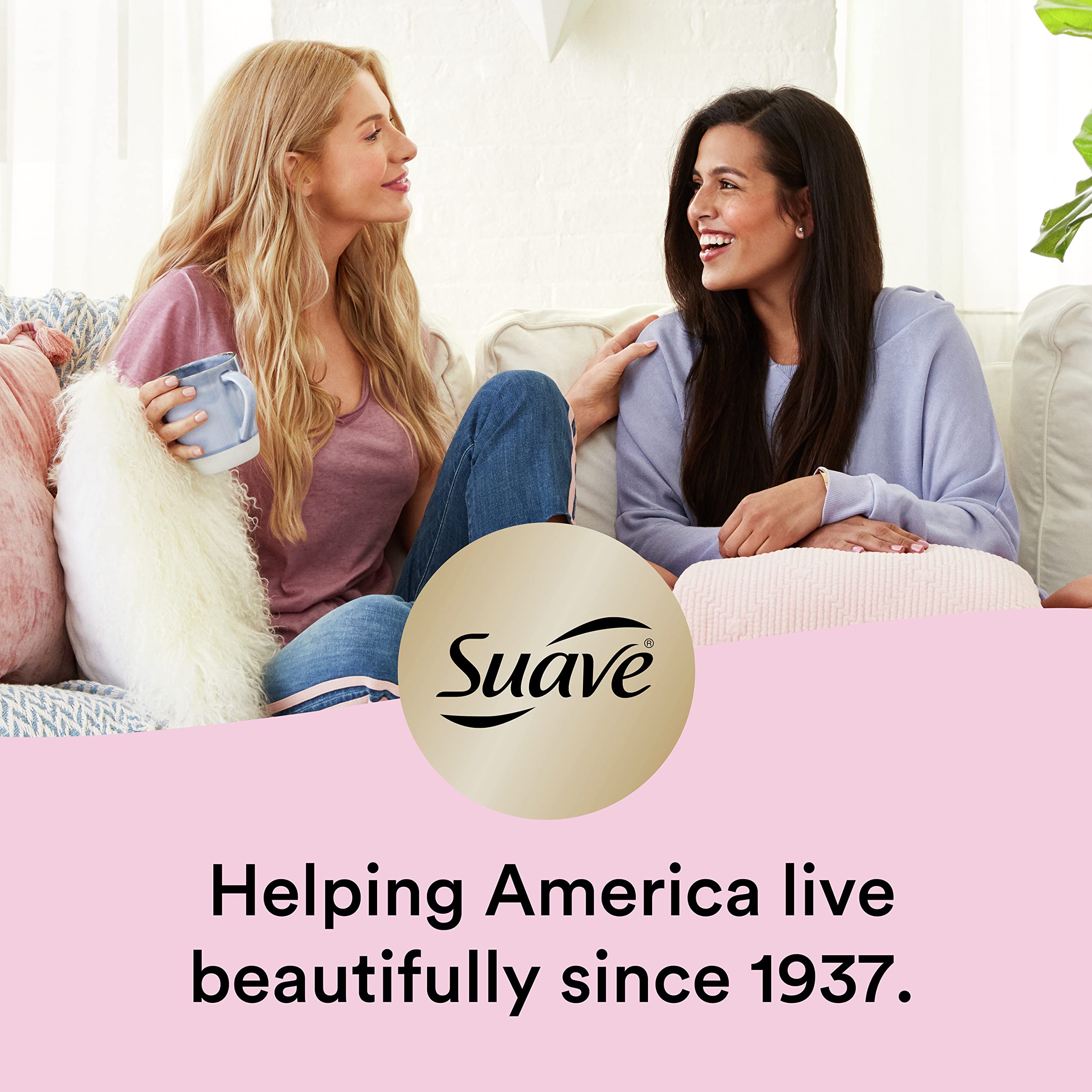 Soft pink bottle of Suave Pink Luscious Curls Shampoo in a clean bathroom.