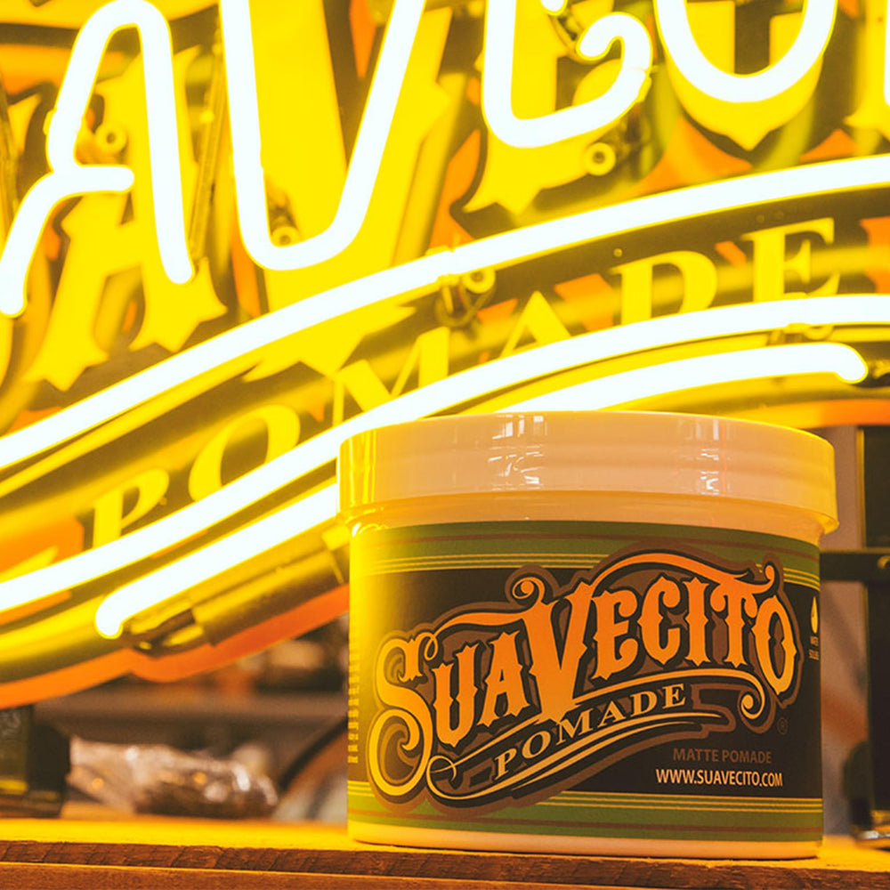 Suavecito Pomade Matte action shot emphasizes water-soluble washout.