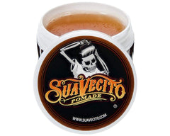Styling with Suavecito Pomade Original Hold for classic slicked-back looks.