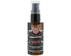 Suavecito Premium Blends beard oil pump in use for clean, easy application.
