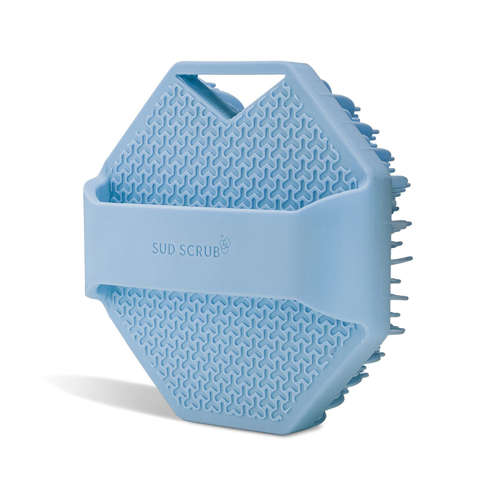 Sud Scrub blue silicone body brush offers comfortable cleansing routine.