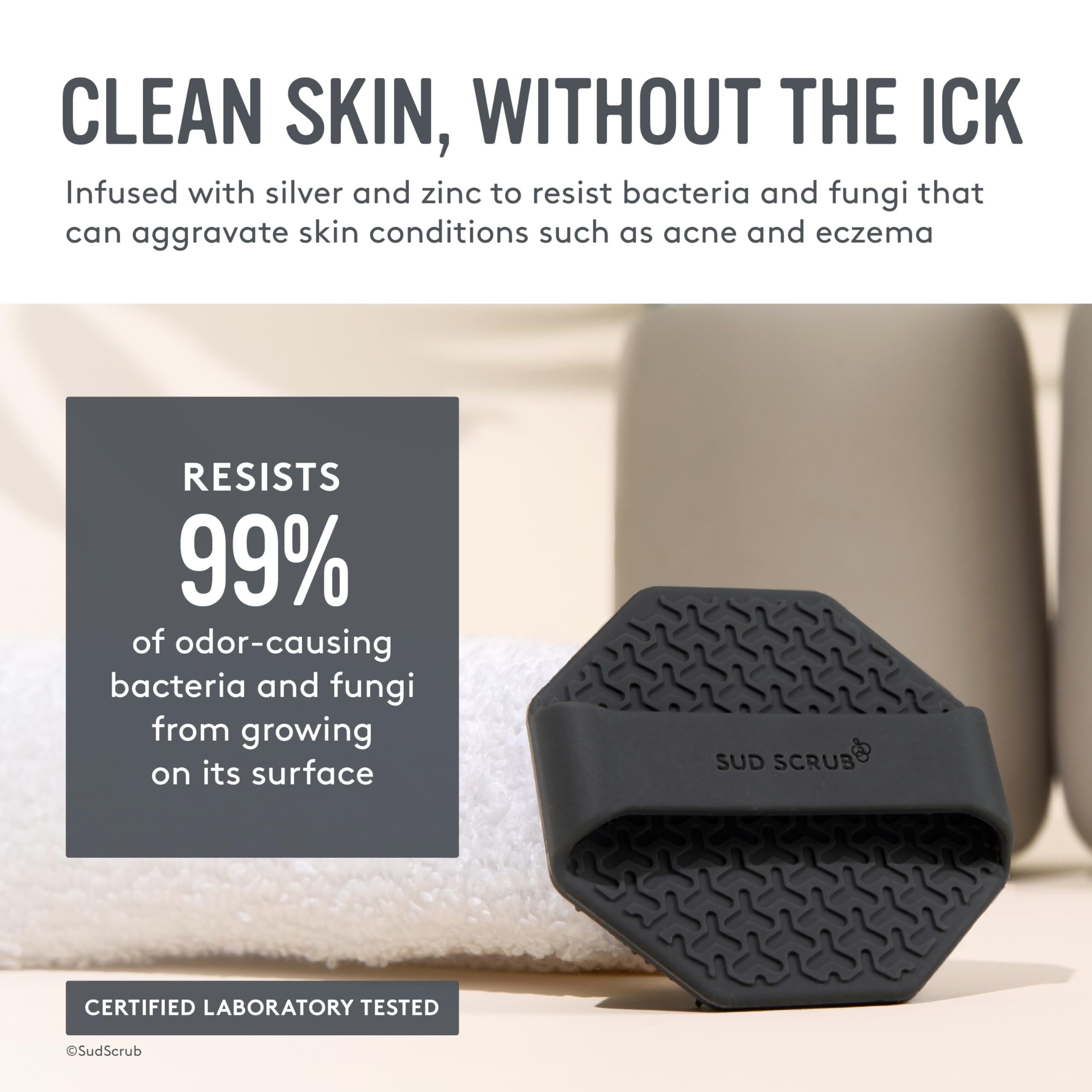 Sud Scrub ergonomic finger-strap ensures secure grip during cleansing.