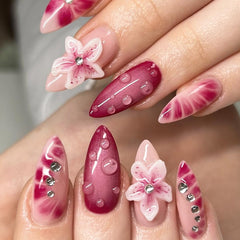 SUMINGGO press-on nails almond shape with purple waterdrop flower for quick at-home glamour.