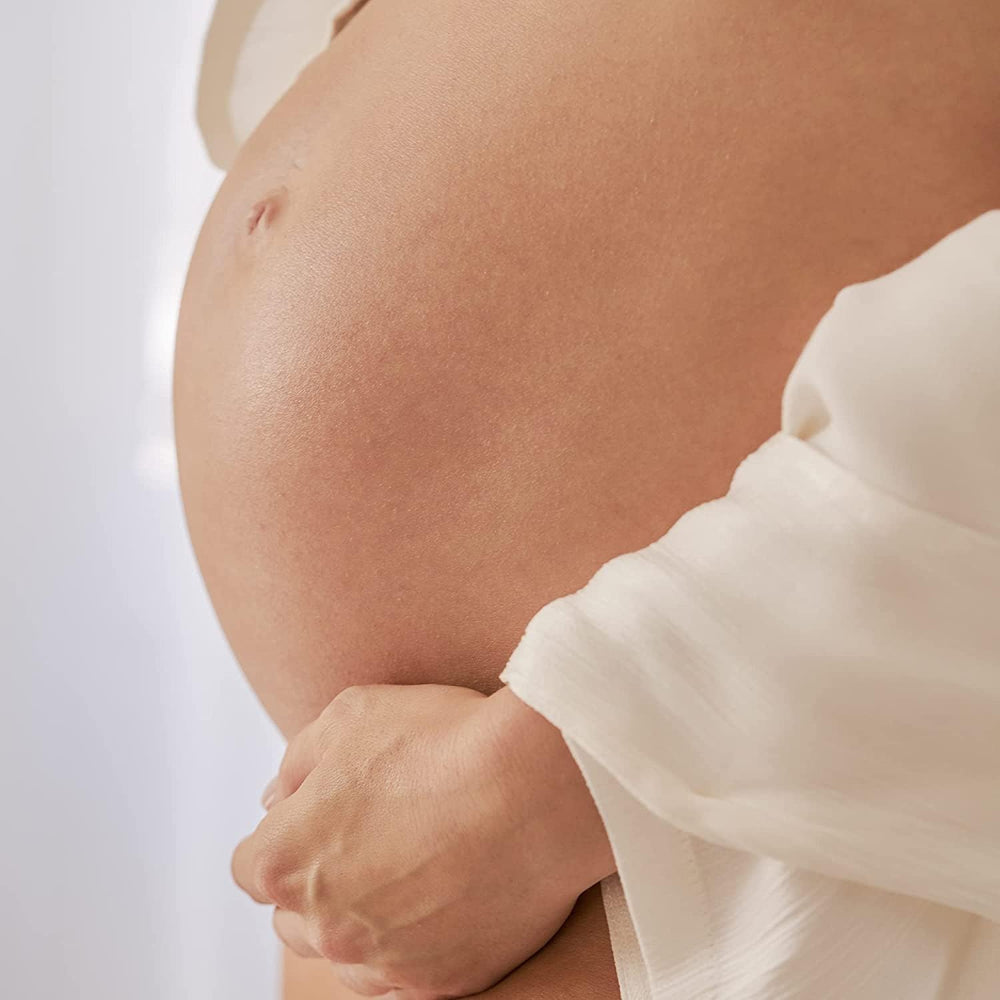 Belly balm applied to dry skin after shower for relief