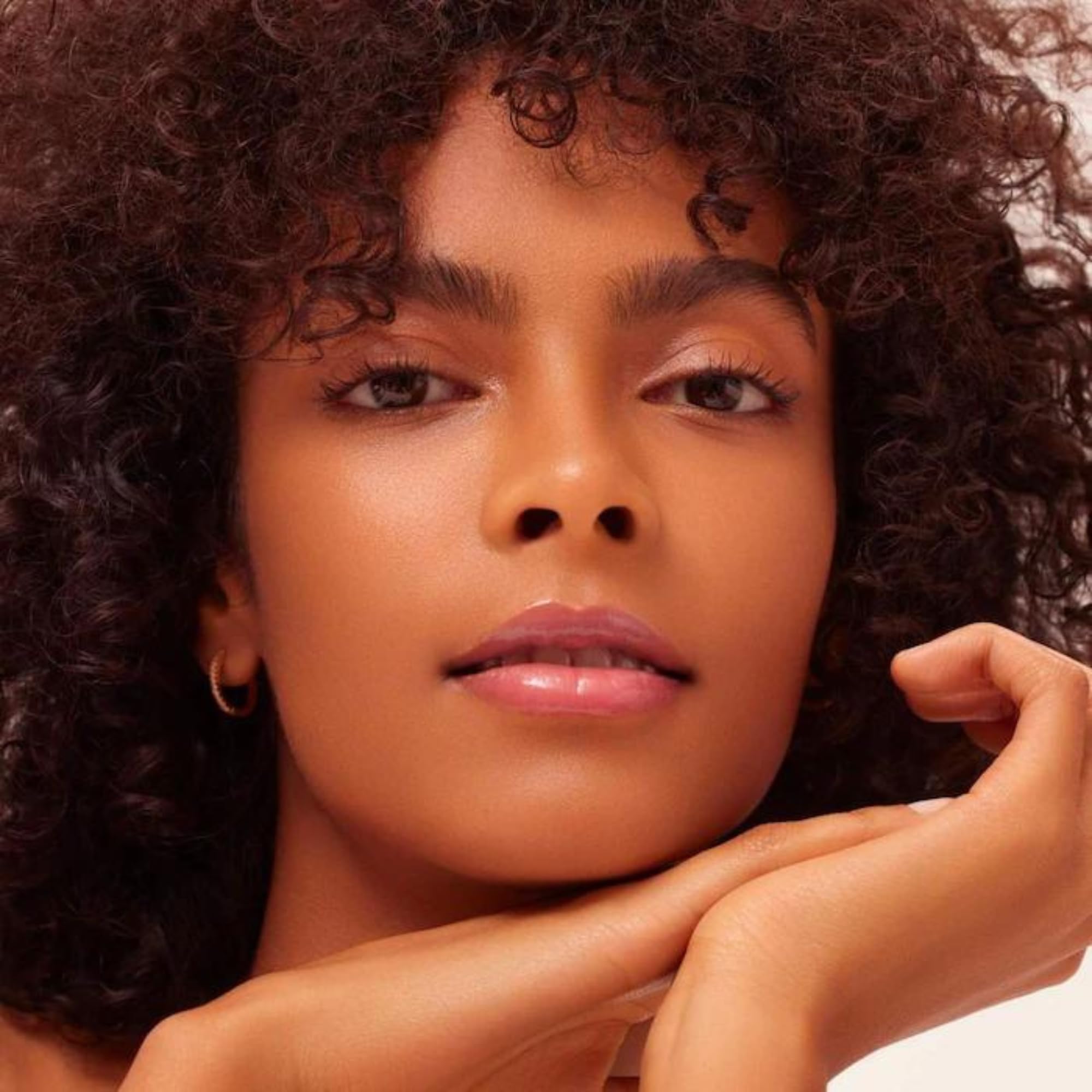 Pink Cloud tint delivers soft, lasting luminosity with Dream Lip Oil.