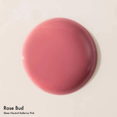 Dream Lip Oil rose bud swatch on skin shows rosy tint and moisture.