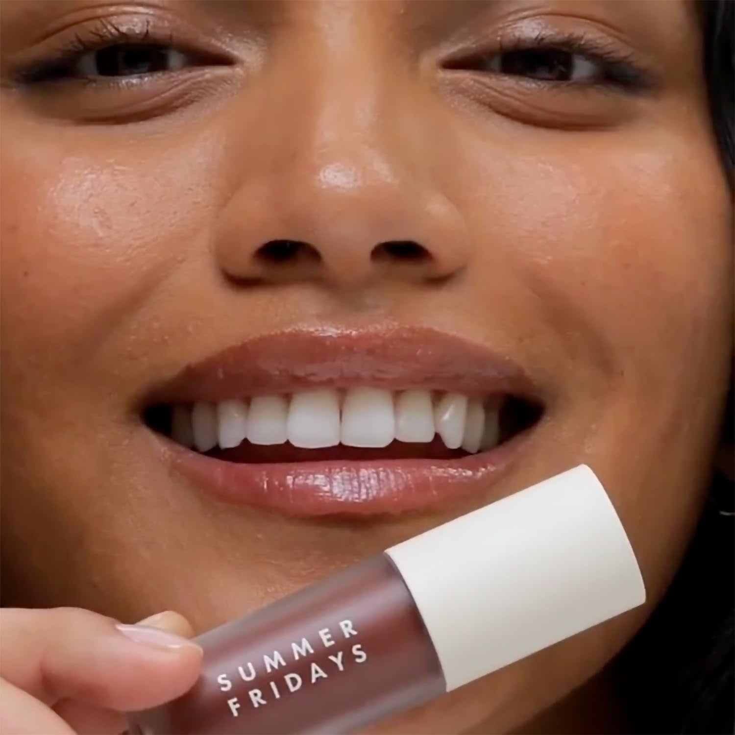Applied swatch reveals a sheer rosewood hue with long-lasting shine