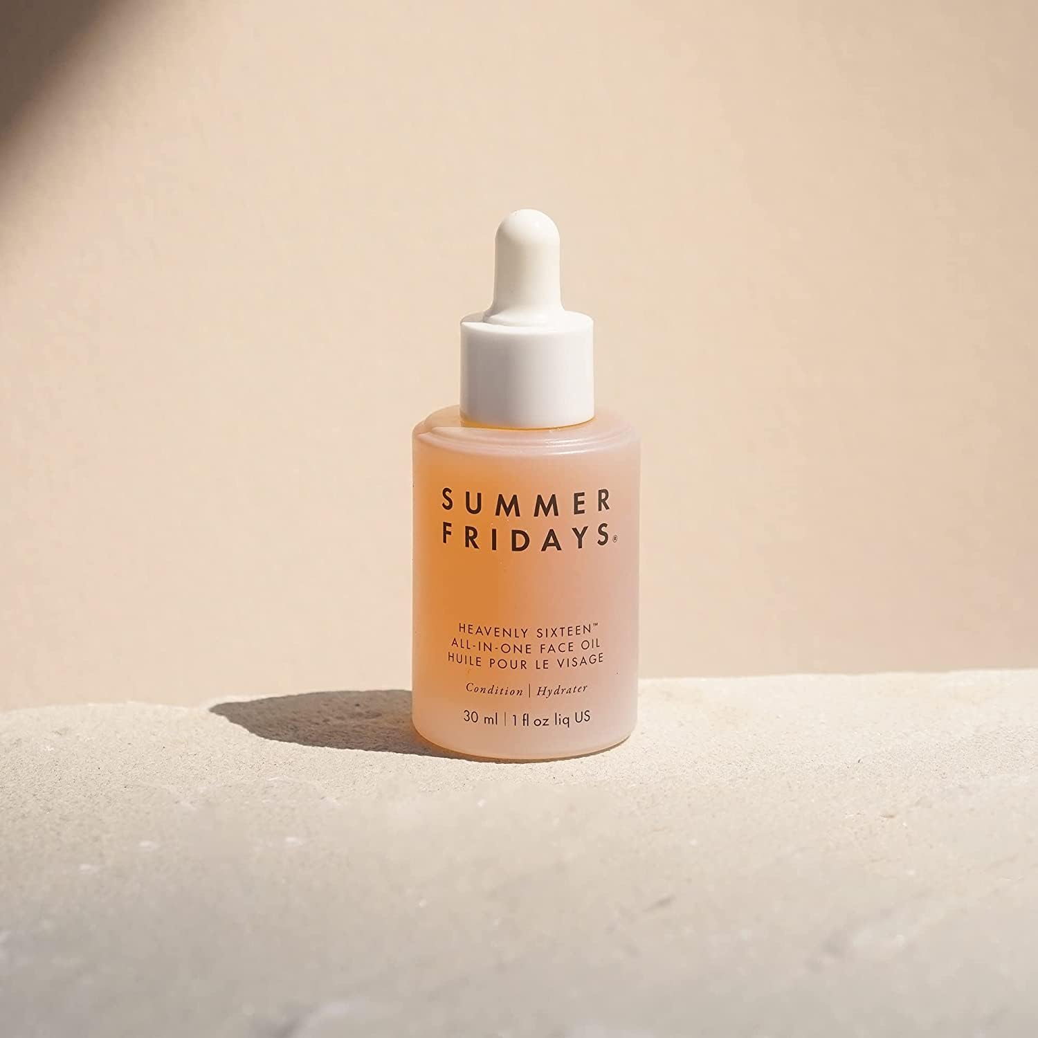 Summer Fridays Heavenly Sixteen dropper releasing silky oil for quick moisture.
