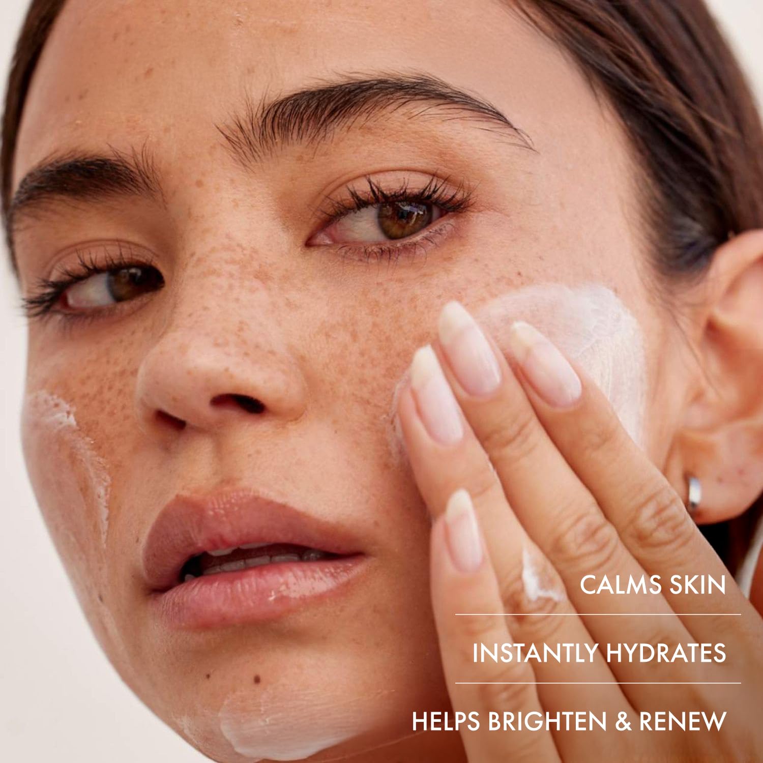 Applying Summer Fridays Jet Lag Mask to the face for hydration