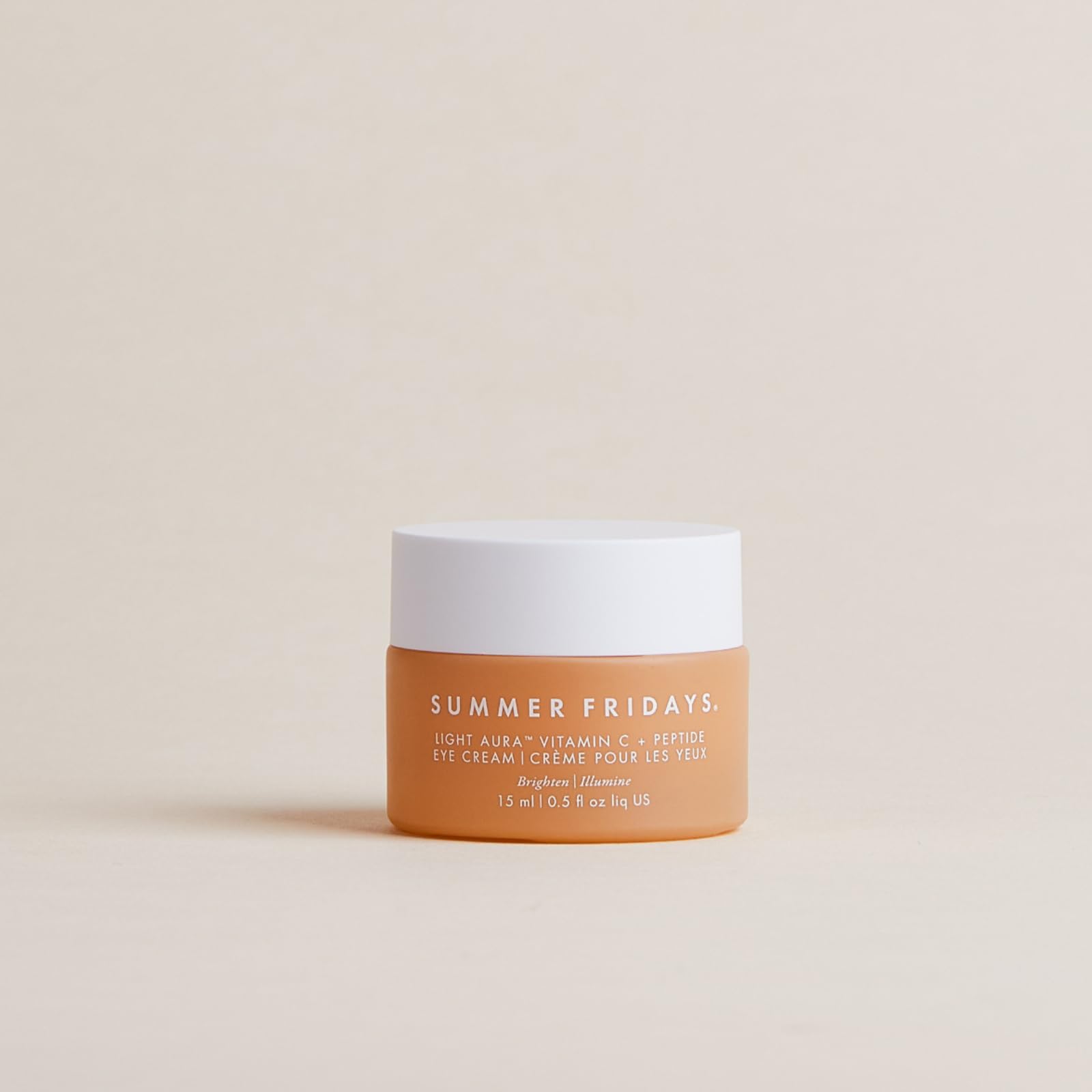 Applying Light Aura Eye Cream for hydration around the eyes.