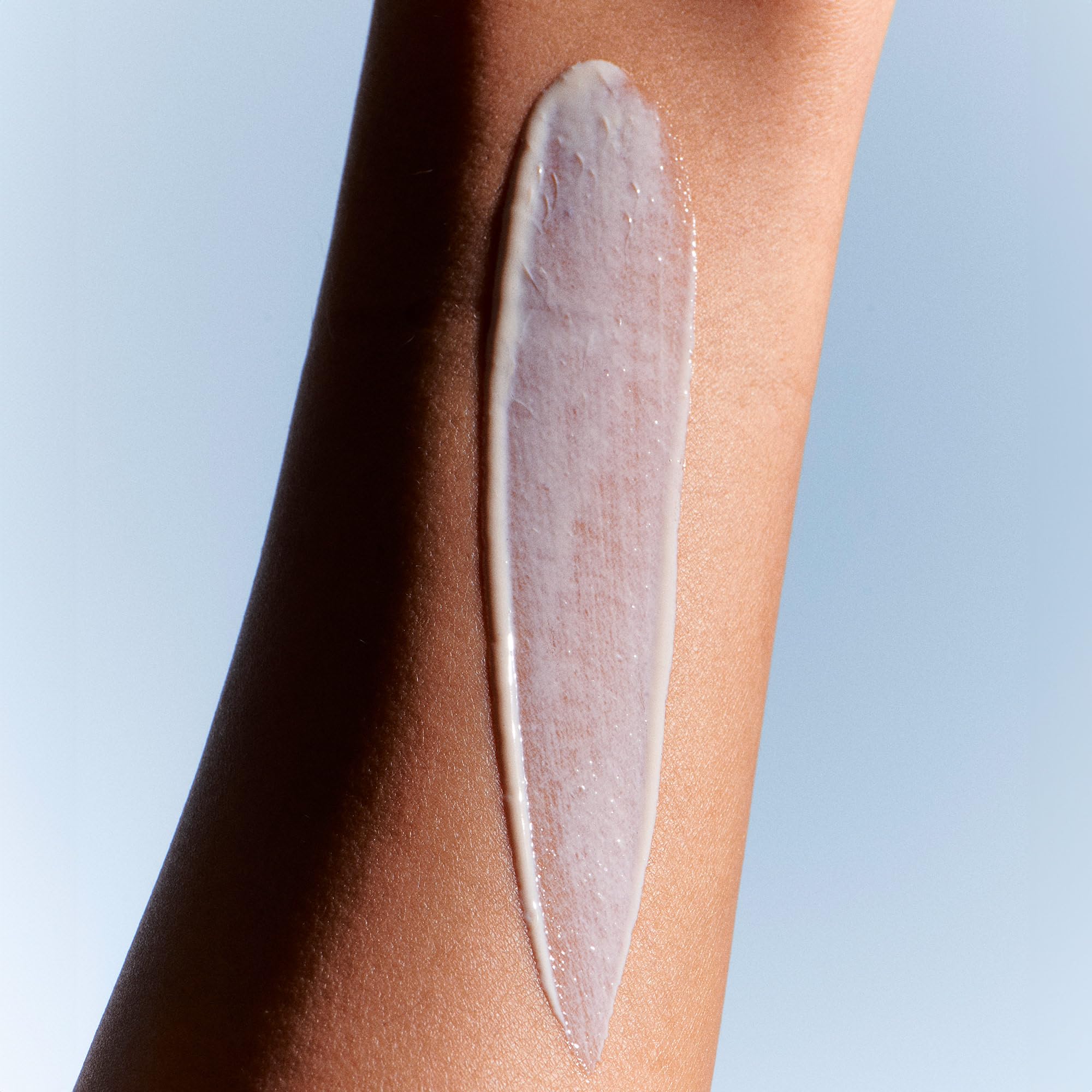 Summer Fridays ShadeDrops SPF 30 lightweight cream texture on skin.