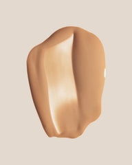 Summer Fridays Sheer Skin Tint applied on cheek for natural warmth.