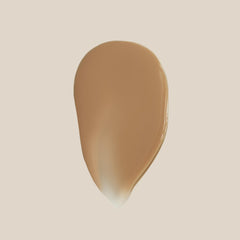 Summer Fridays Sheer Skin Tint swatch on arm shows light coverage and olive undertone.