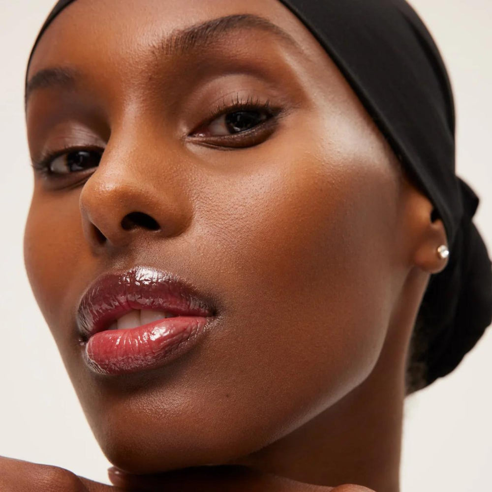 Summer Fridays lip butter evokes a natural rosy-brown hue for daily looks.