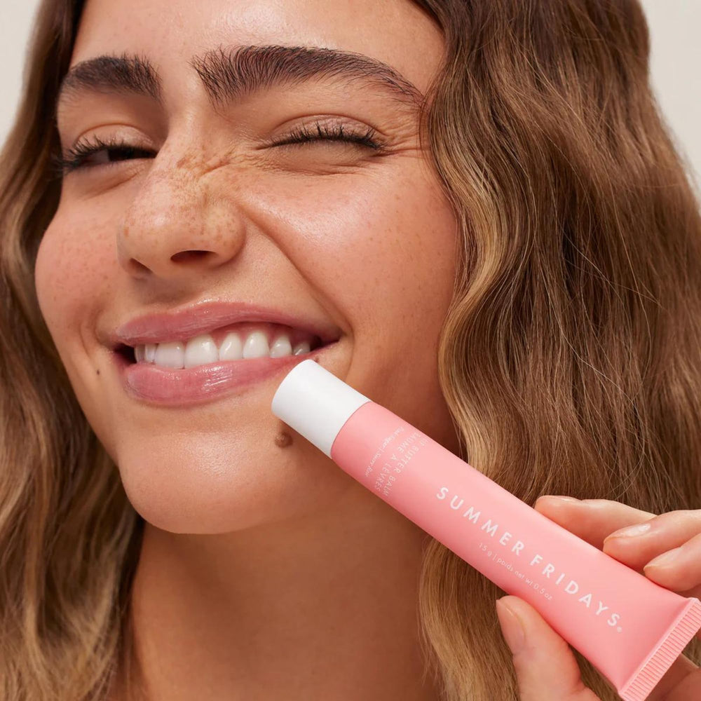 Summer Fridays Pink Sugar lip balm being applied on lips for hydration.