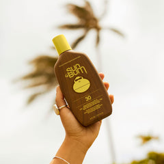 Applying Sun Bum Original SPF 30 on skin for protection