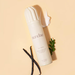 Hand holding Sundae bottle demonstrates easy dispensing for a quick cleanse.
