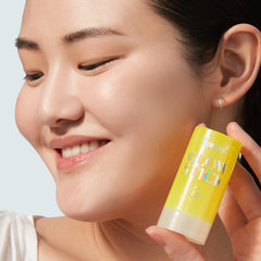 Supergoop Glow Stick dry oil texture on skin for dewy hydration.