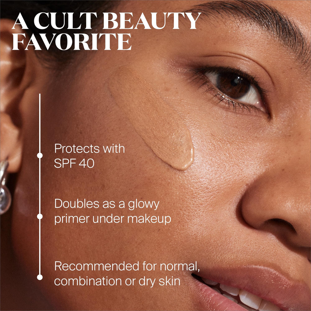 Glow Stick SPF 50 on cheek demonstrates dewy highlight portability.