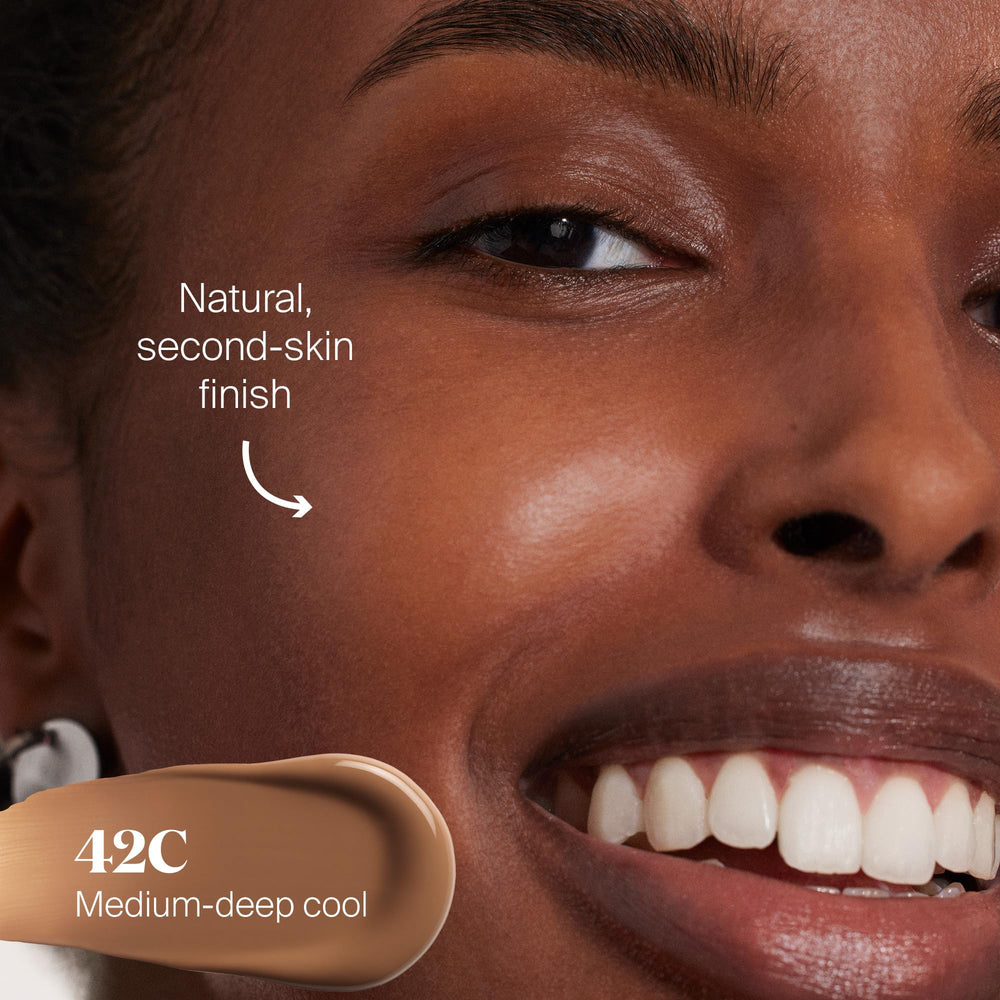 Fingers applying Protec(tint) for seamless blend on the skin